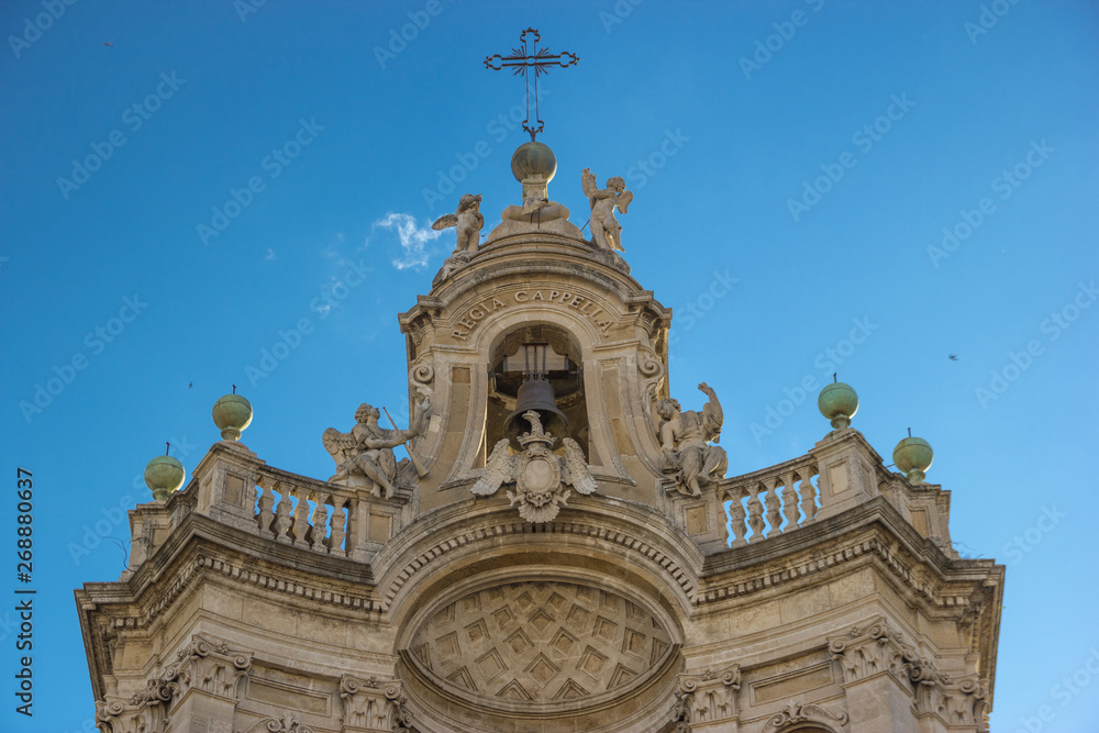 Catania detail of baroque architecture in basilica Collegiata, top of facade decorations