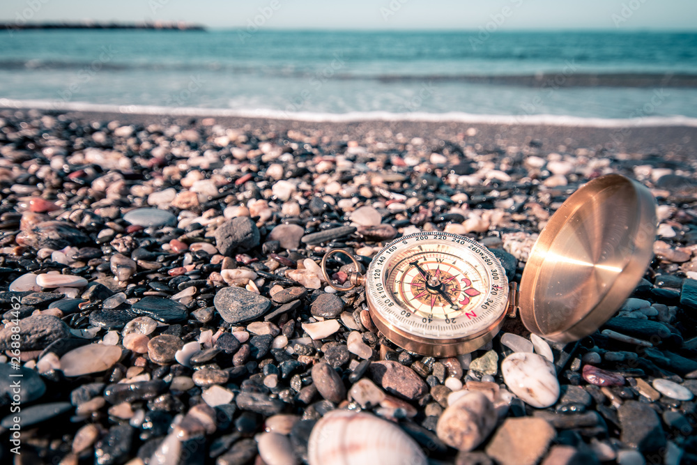 compass next to the mediterranean sea