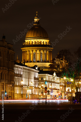 Saint Isaacs Cathedral by night illuminated by street lights as seen from Palace Square next to Eremitage during winter (St. Petersburg, Russia, Europe)