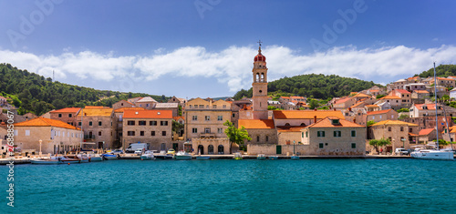 Pucisca is small town on Island of Brac, popular touristic destination on Adriatic sea, Croatia. Pucisca town Island of Brac. Adriatic coast town Pucisca. photo