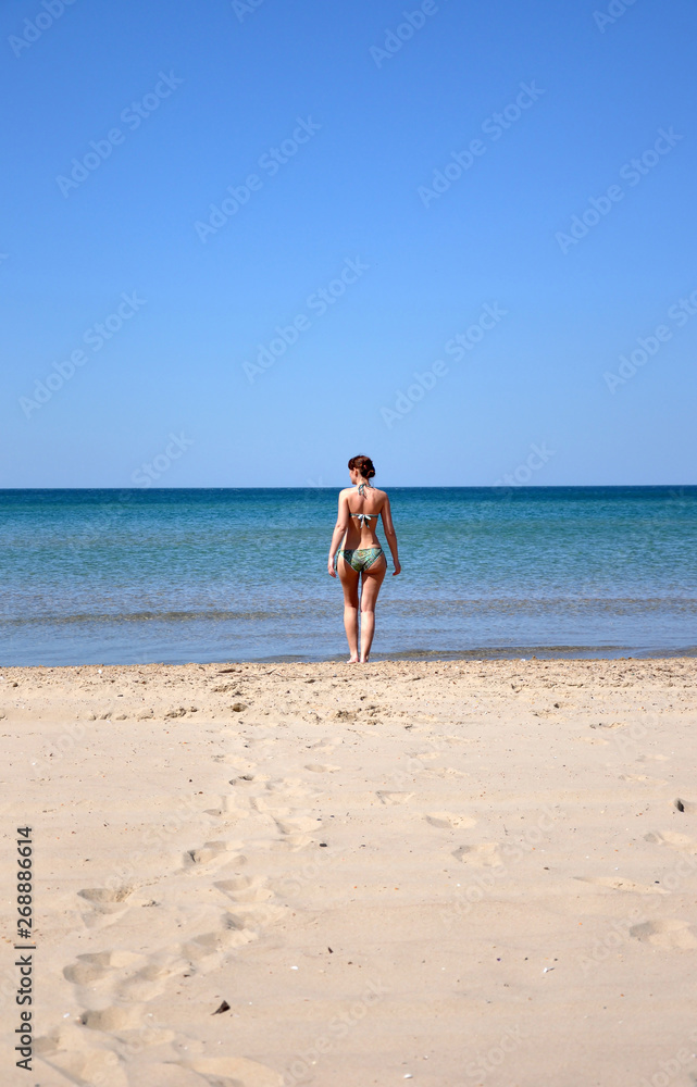 The girl on the sandy seashore