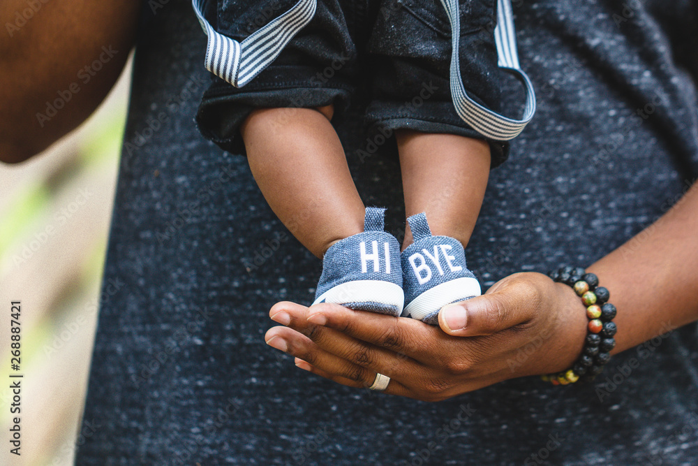 Baby boy stands on father's hand Stock Photo Adobe Stock