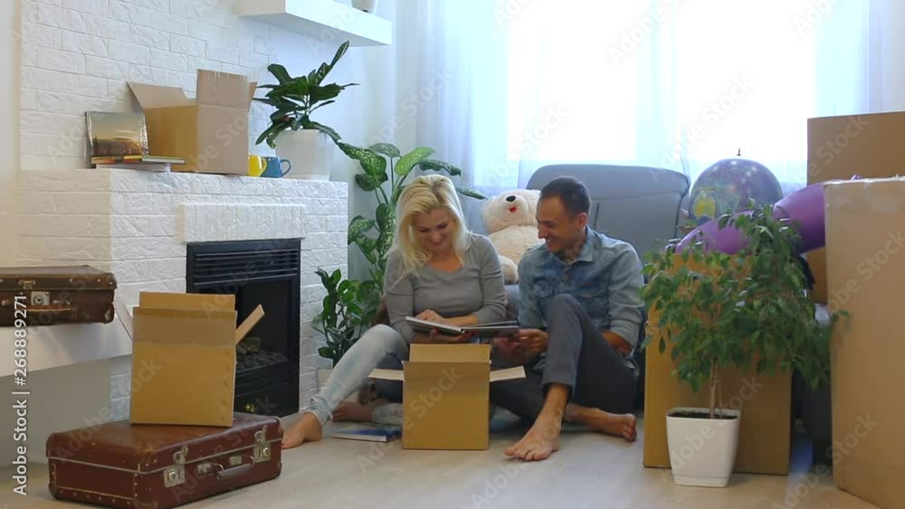 Young couple very happy and excited about moving into new apartment Young couple very happy and excited about moving into new apartment