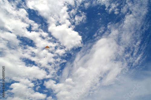 Colored kite in the blue sky