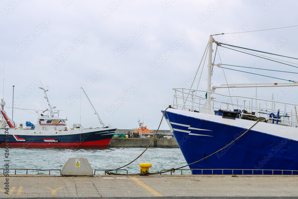 Two fishing boats in Howth Harbor. Ireland