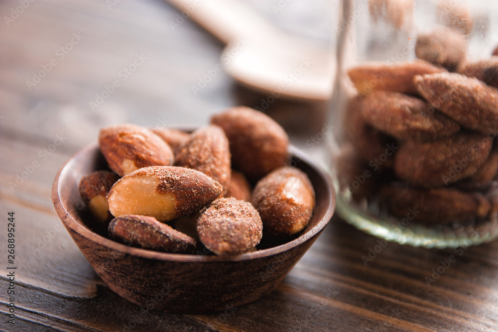 almond nut in a bowl on wooden table almond nut in a bowl on wooden table