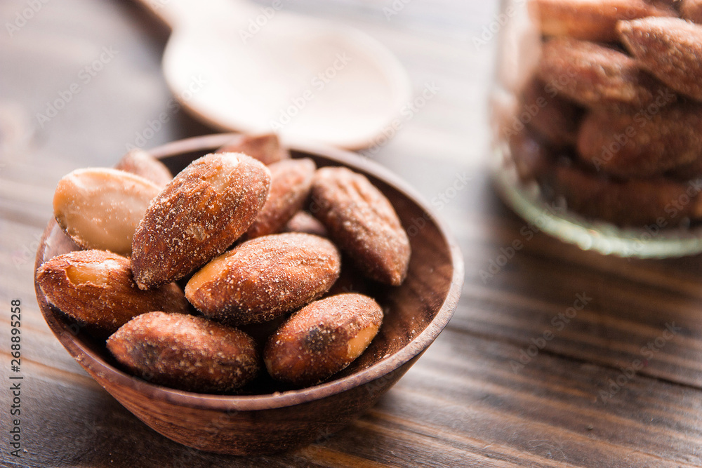 almond nut in a bowl on wooden table almond nut in a bowl on wooden table