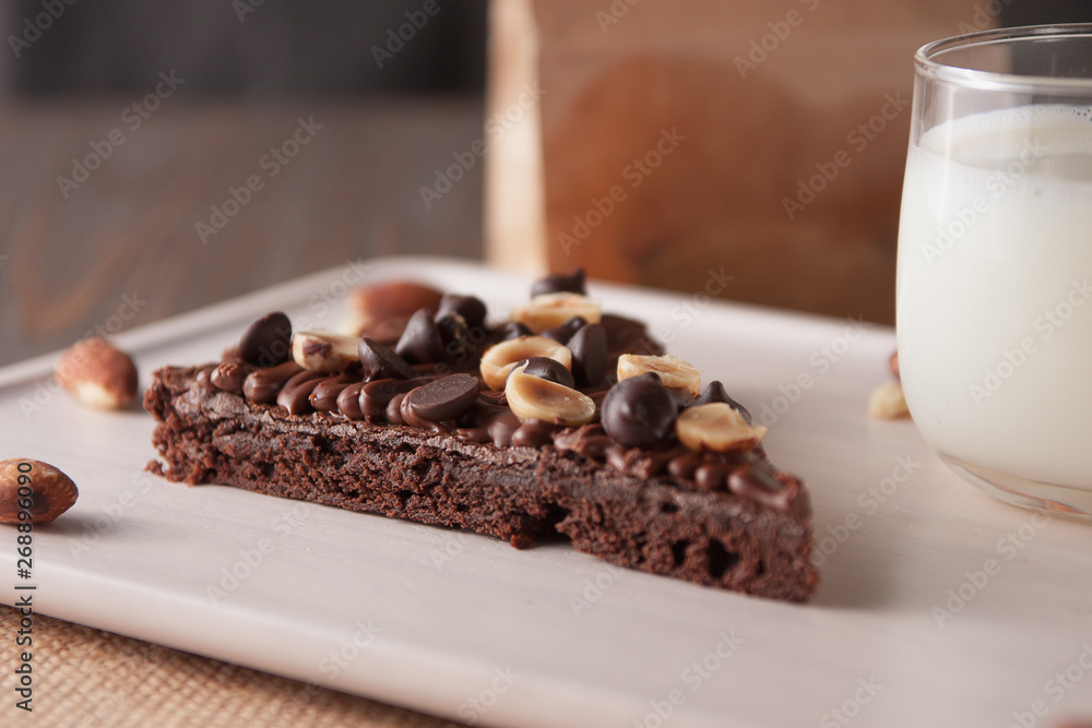 chocolate cake with marshmallows , cut on wooden board chocolate cake with marshmallows , cut on wooden board