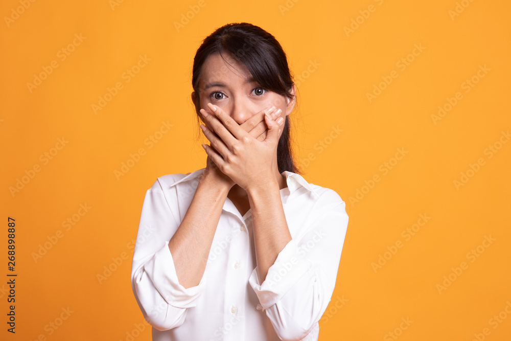 Beautiful young Asian woman close her mouth. Beautiful young Asian woman close her mouth.