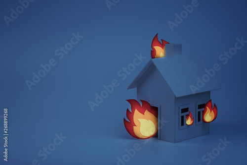 cardboard house lit with paper fire, concept, night