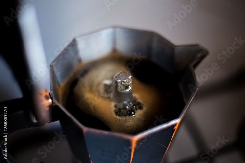 Close-up how coffee rises up in moka pot