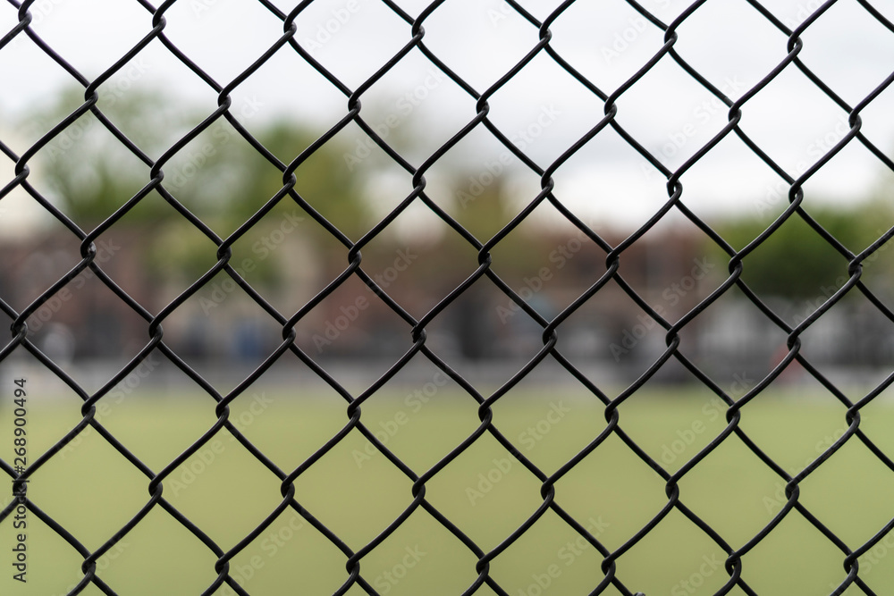 Chain link fence with blurry background Chain link fence with blurry background