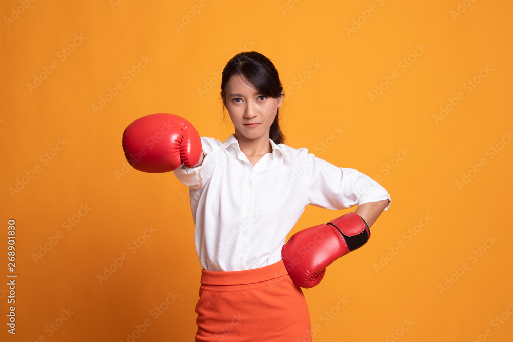 Young Asian woman with red boxing gloves. Young Asian woman with red boxing gloves.