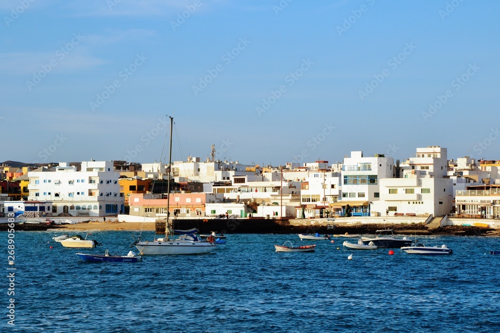 Various yachts and boats in the Corralejo harbour.  Harbor located on the northern tip of Fuerteventura.