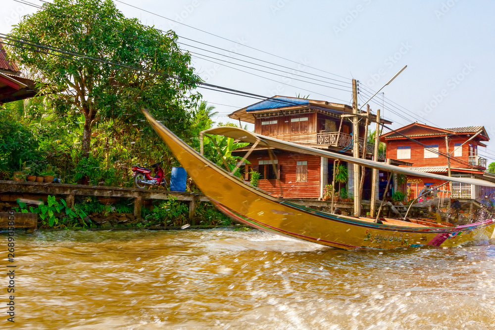 Tourist boat sailing on the River Kwai. Thailand.