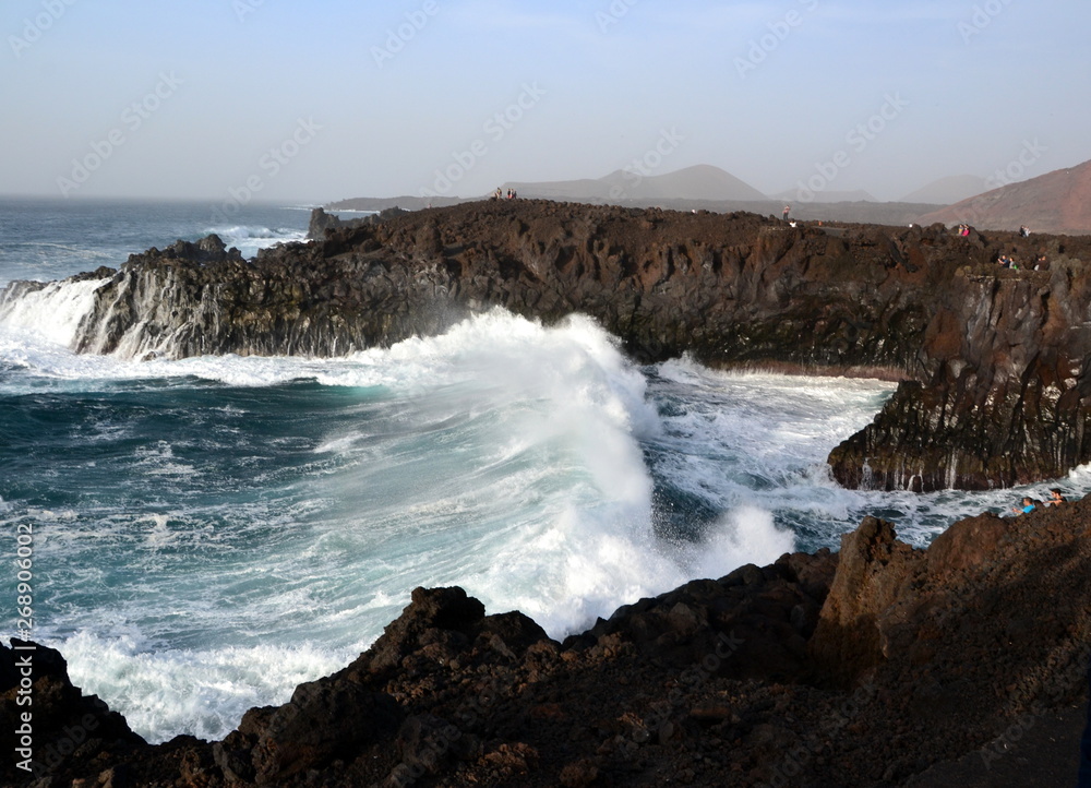 Volcanic coastal landscape with huge waves on the Atlantic Ocean. Los Hervideros, Lanzarote, Canary Islands, Spain