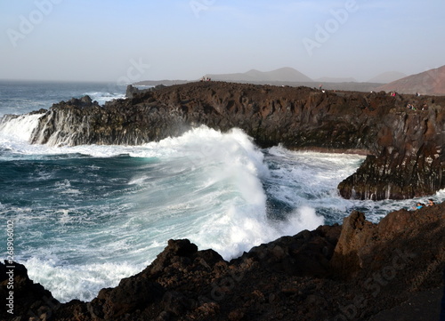 Volcanic coastal landscape with huge waves on the Atlantic Ocean. Los Hervideros  Lanzarote  Canary Islands  Spain
