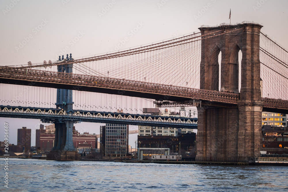 Naklejka premium Close up landscape of Manhattan Bridge and Brooklyn Bridge on the East River - New York City, NY