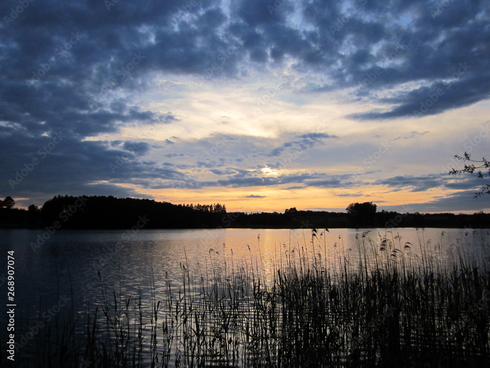 Beautiful sunset at the lake. Poland, Masuria - the land of a thousand lakes.