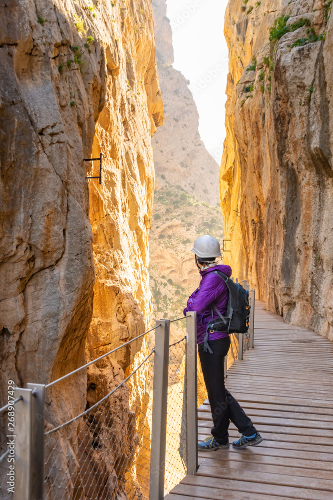 tourist woman in El Caminito del Rey or King's Little Path, one of the most Dangerous Footpath reopened 2015 Malaga, Spain