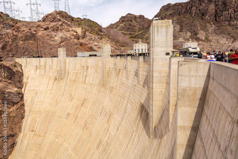 Hoover Dam, a concrete arch-gravity dam located on the Nevada and Arizona border, a top tourist attraction. USA Hoover Dam, a concrete arch-gravity dam located on the Nevada and Arizona border, a top tourist attraction. USA