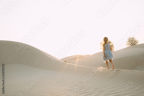 Little girl walking in the desert