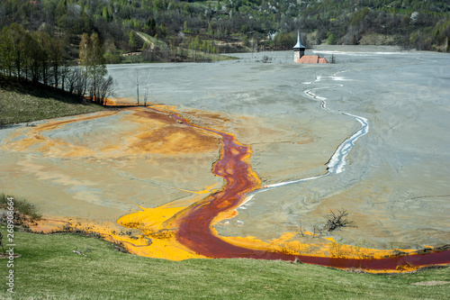 Pollution of a lake with contaminated water from a gold mine in Roșia Montană, Romania. photo