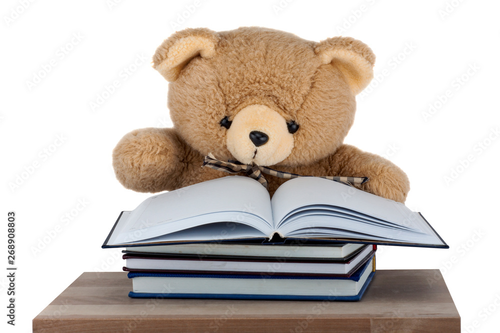 Teddy Bear sitting on the desk isolated on white background Teddy Bear sitting on the desk isolated on white background