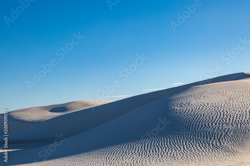 Light and shadow on the gypsum sand dunes, at White Sands National Monument, New Mexico