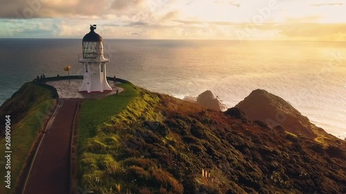 Flying by Cape Reinga lighthouse, the northernmost point of New Zealand and popular tourist attraction. Aerial footage.