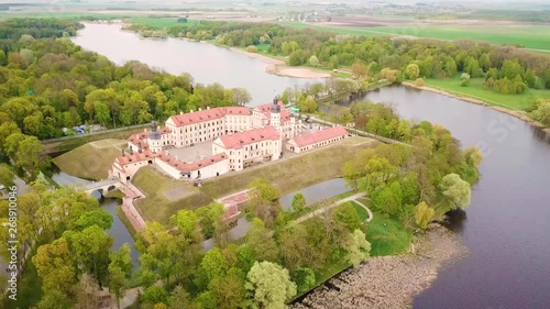 Aerial top view of Medieval castle in Nesvizh. Niasvizh ancient town in spring. Minsk Region, Belarus. UNESCO world heritage. photo