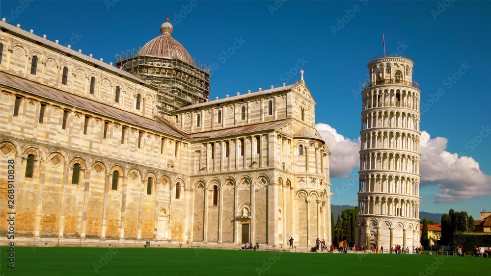 Tourists at Pisa Cathedral and Leaning Tower of Pisa in Italy