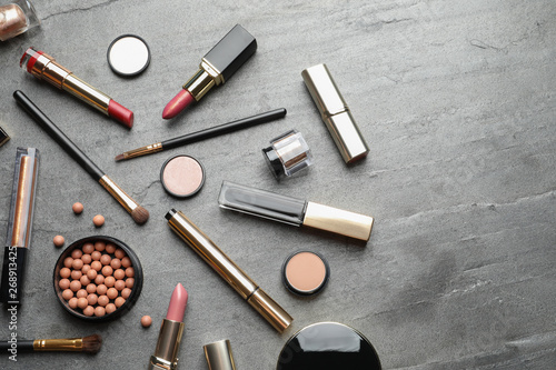 Set of luxury makeup products on grey background, flat lay