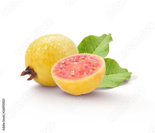 Obraz na plátně Ripe yellow guava fruit with a sliced piece with water drops isolated on white b