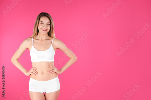 Young slim woman on color background, space for text. Perfect body