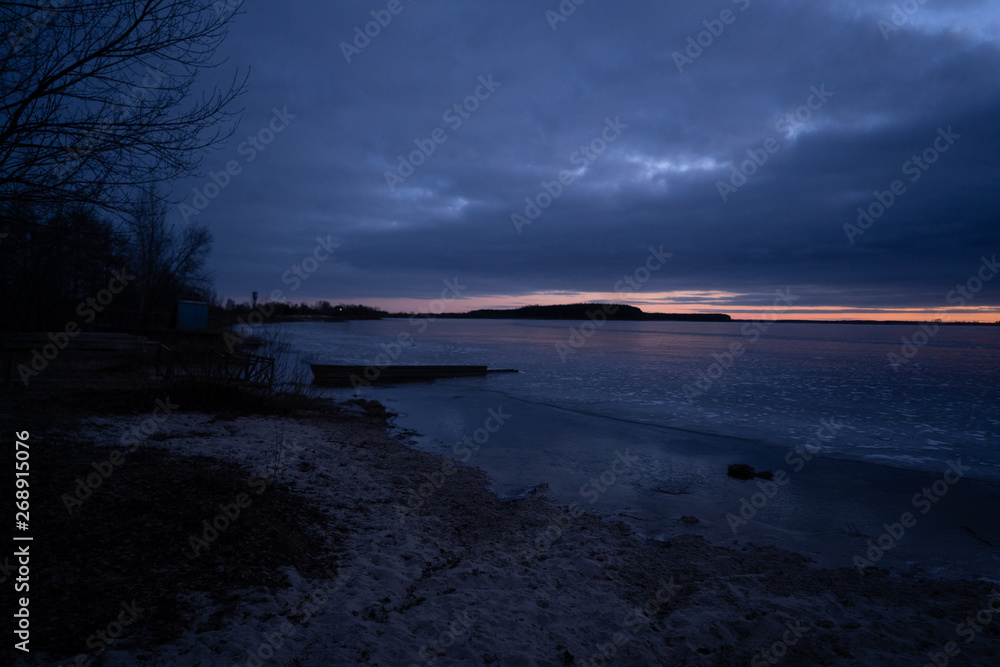 beautiful cold sunrise over a frozen lake