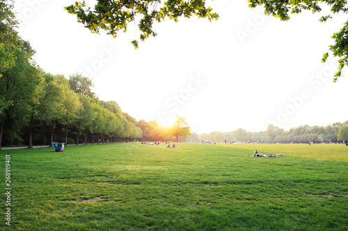 Beautiful Sunset and people grilling and having a picnic at the Stadtpark in Hamburg, Germany. photo
