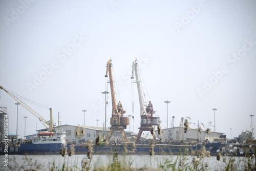 cranes in port © faybanart