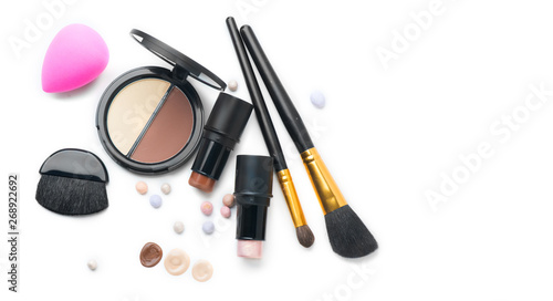 Face contouring makeup products over white. Highlight, shade, contour and blend. Make up artist tools