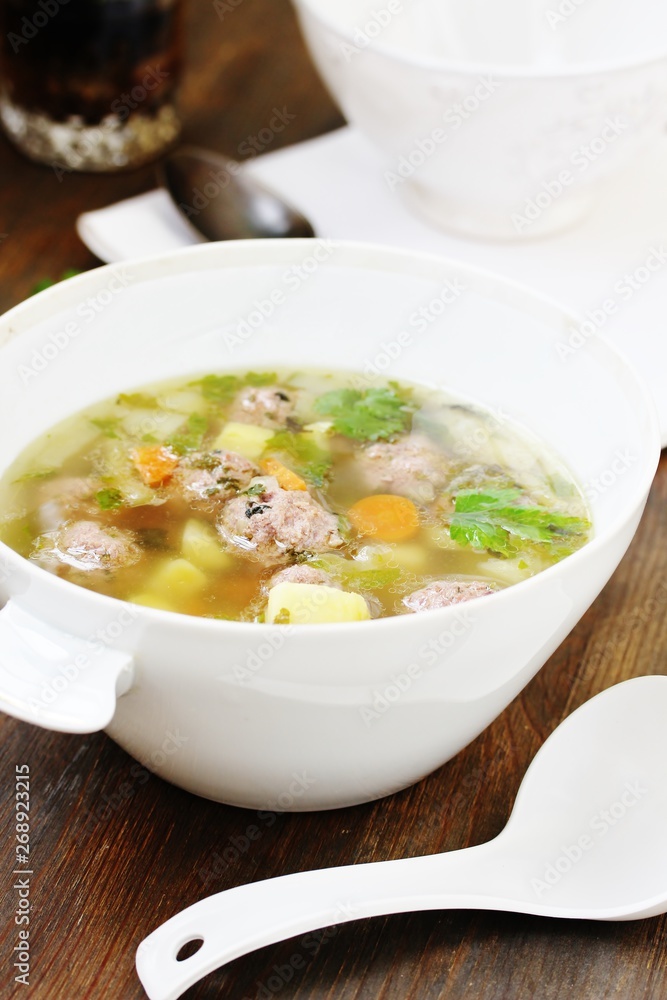 Italian Wedding Meatball Soup. soup in a beautiful white bowl