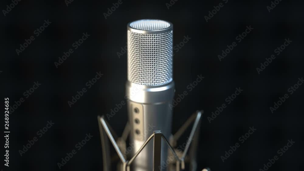 Camera approaching close to professional microphone in a dark sound recording studio. Close up. Camera approaching close to professional microphone in a dark sound recording studio. Close up.