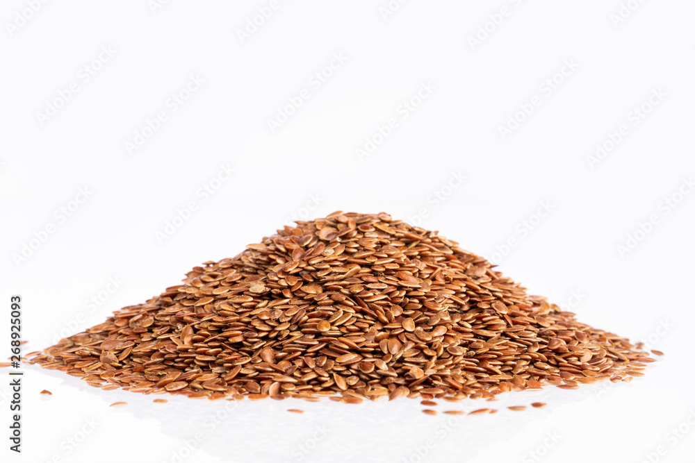 Heap of linseeds on white - Linum usitatissimum Heap of linseeds on white - Linum usitatissimum