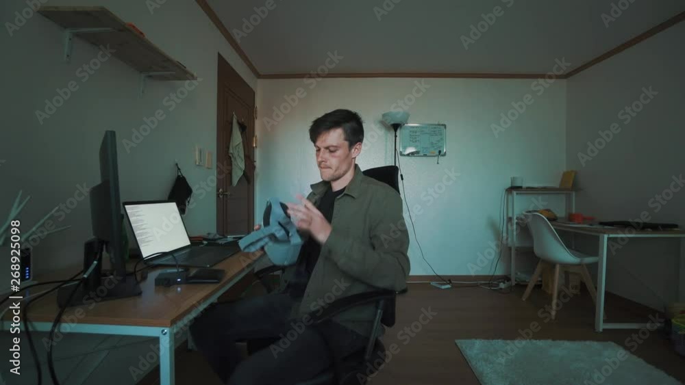 Young Entrepreneur tests out VR goggles - technology - augmented reality projection of drone footage appears Young Entrepreneur tests out VR goggles - technology - augmented reality projection of drone footage appears