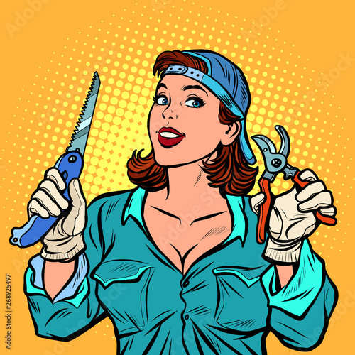 woman gardener in the garden with a cutter and saw