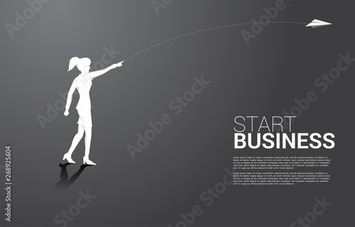silhouette of businesswoman throw out origami paper airplane. Business Concept of start business and entrepreneur