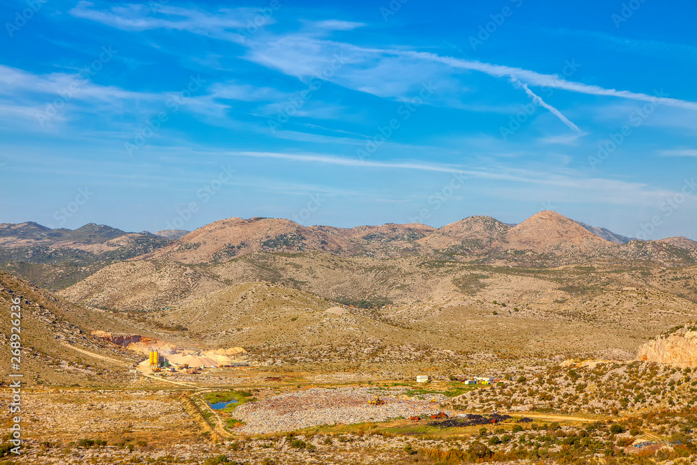 Fototapeta premium stone quarry in the mountains , summer landscape