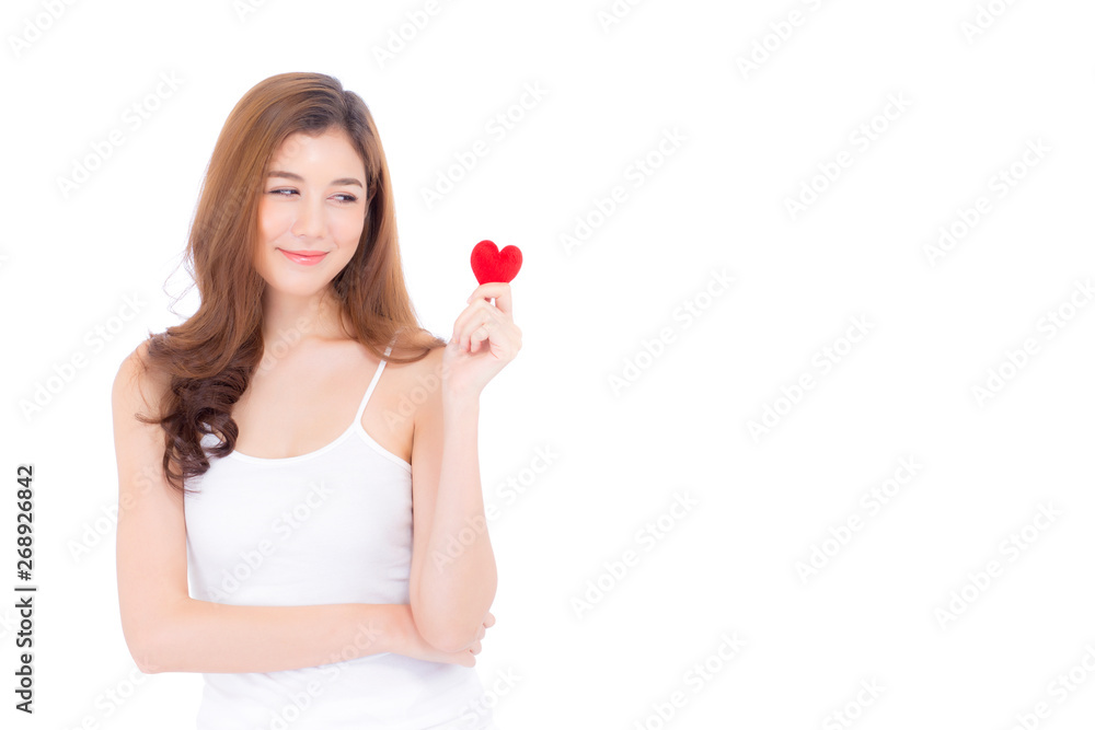 Portrait of beautiful asian young woman holding red heart shape pillow and smile isolated on white background, valentines day, holiday concept. Portrait of beautiful asian young woman holding red heart shape pillow and smile isolated on white background, valentines day, holiday concept.