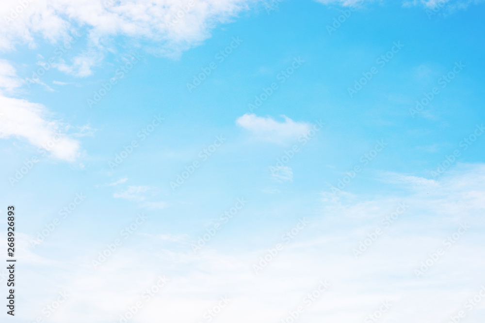 Blue sky background and white clouds soft focus, and copy space