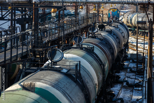 Railway trains with tanks for the transport of petroleum products are on the siding