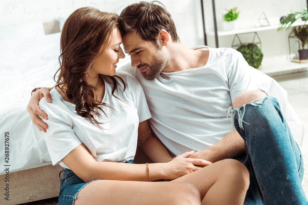 cheerful man and happy girl sitting with closed eyes in bedroom cheerful man and happy girl sitting with closed eyes in bedroom